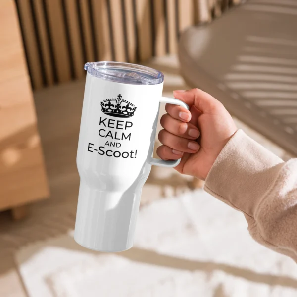 25oz stainless steel travel mug with "keep calm And E-Scoot" Text in someone's hand