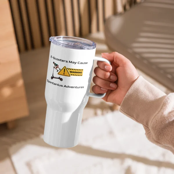 E-Scooter Travel Mug: Warning May Cause Spontaneous Adventures held in a persons hand